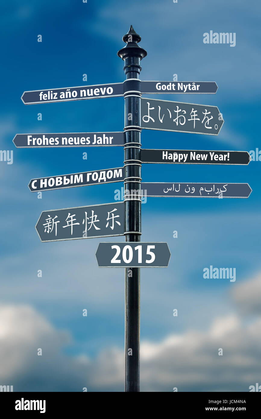 Whit Signpost Felice Anno Nuovo in molte lingue Foto Stock