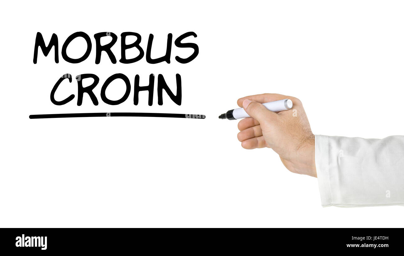 Mano mit Stift schreibt morbo di Crohn Foto Stock