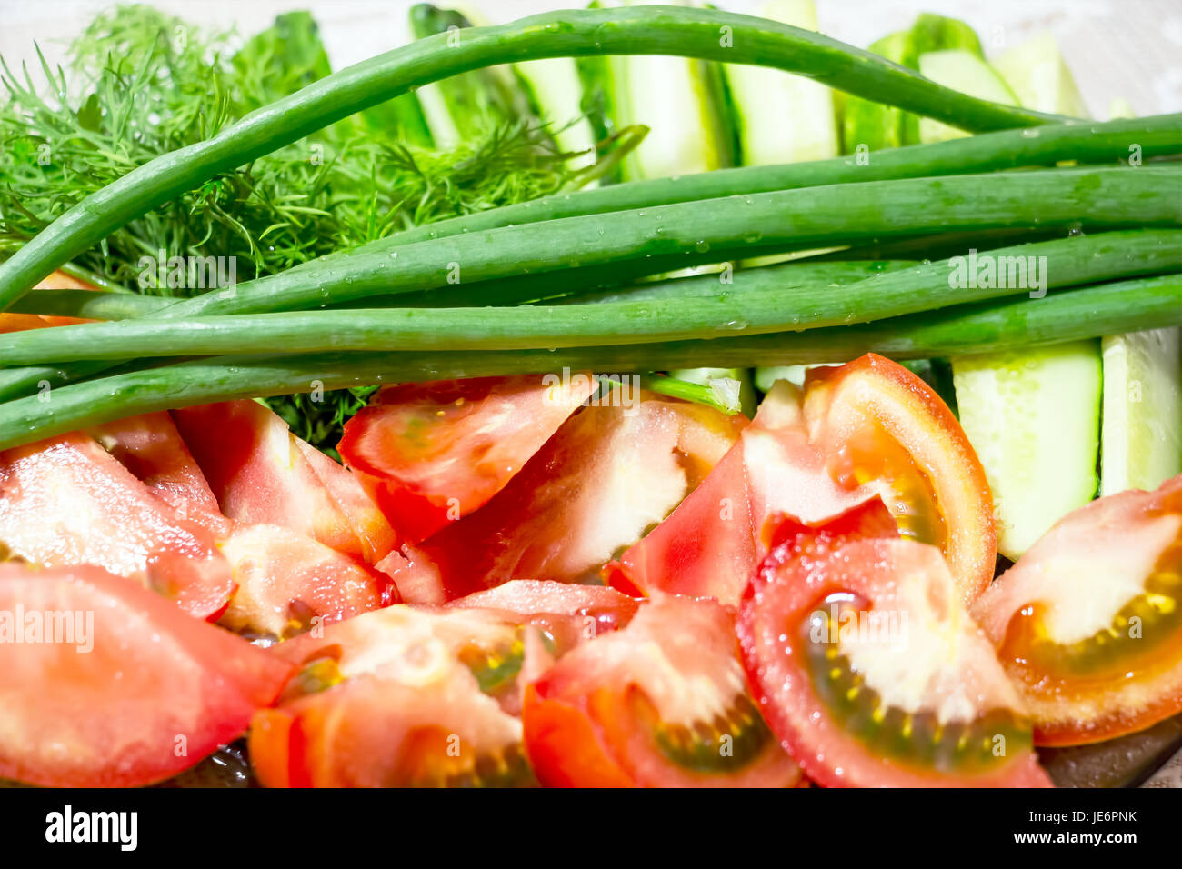 Pomodori a fettine e le cipolle verdi Foto Stock