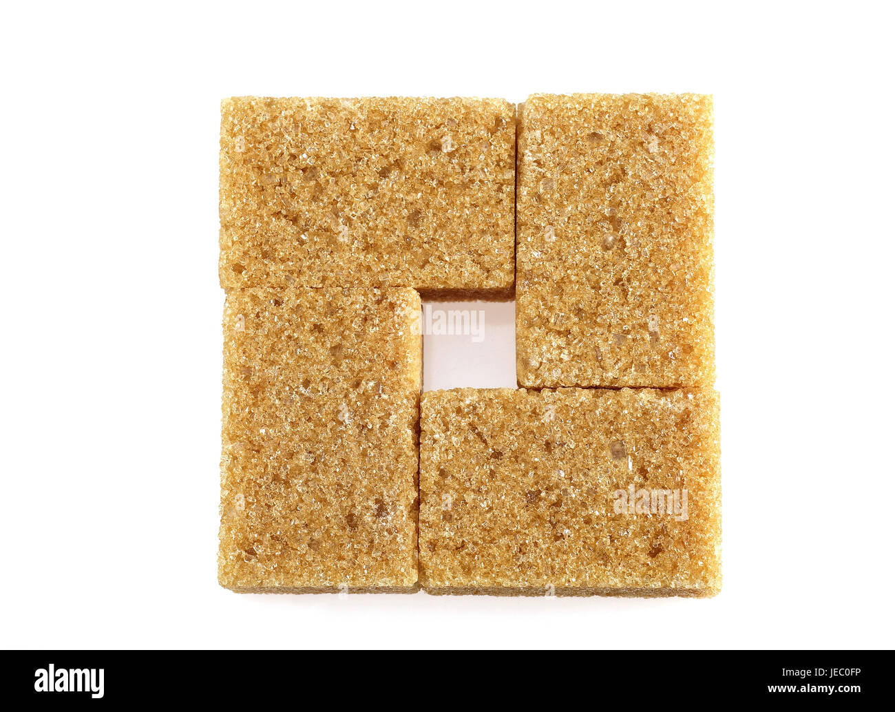 Lo zucchero di canna, cubo, sfondo bianco Foto Stock