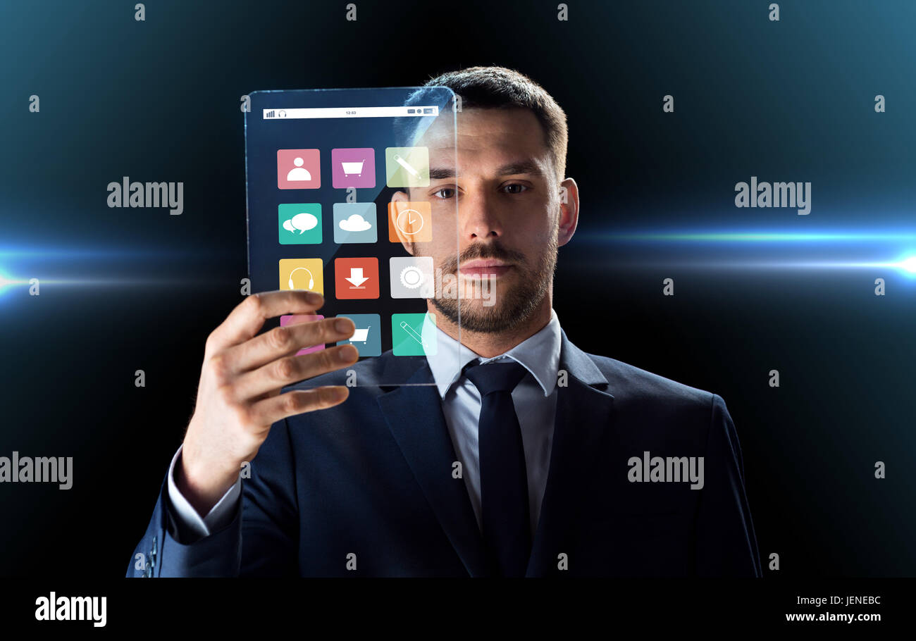 Imprenditore lavora con trasparente tablet pc Foto Stock