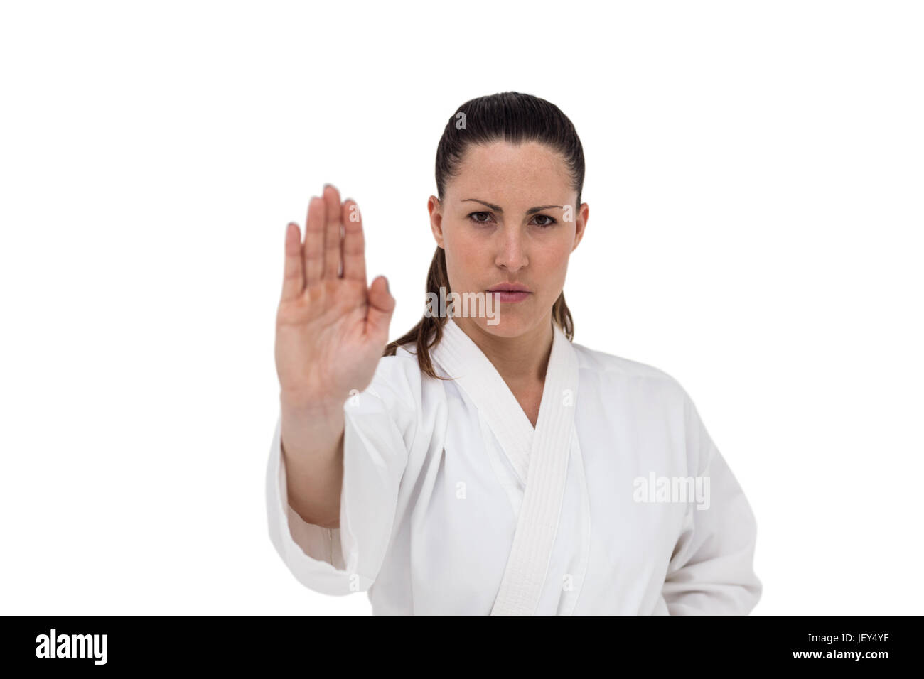 Combattente donna eseguendo il karate posizione Foto Stock