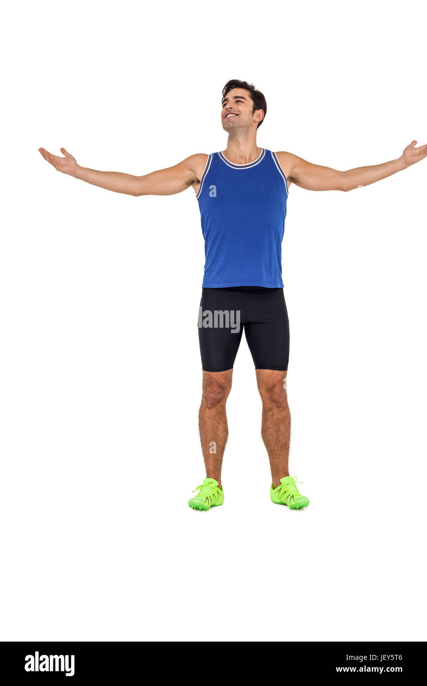 Atleta in piedi con le braccia tese Foto Stock