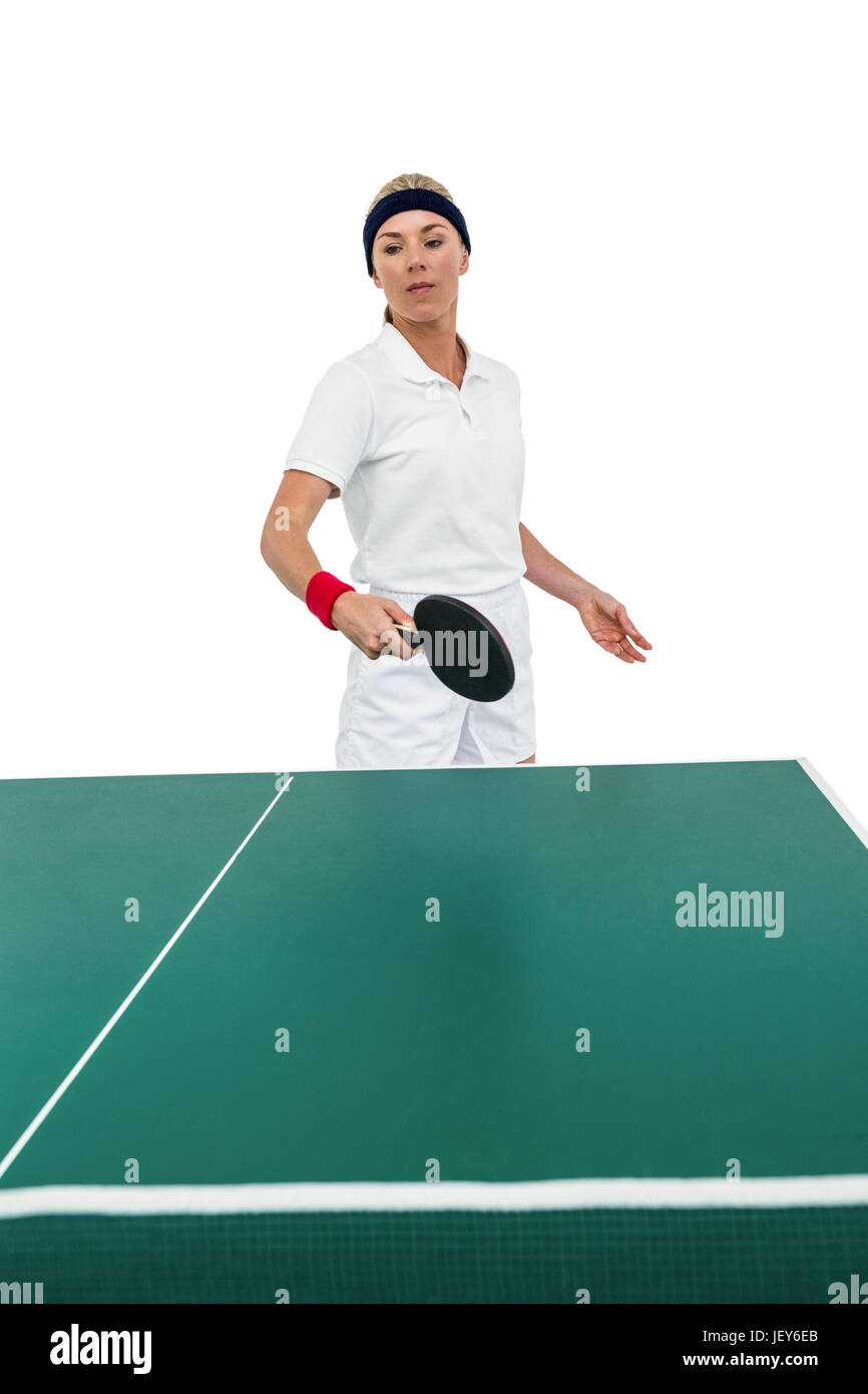 Atleta femminile giocando a ping-pong Foto Stock