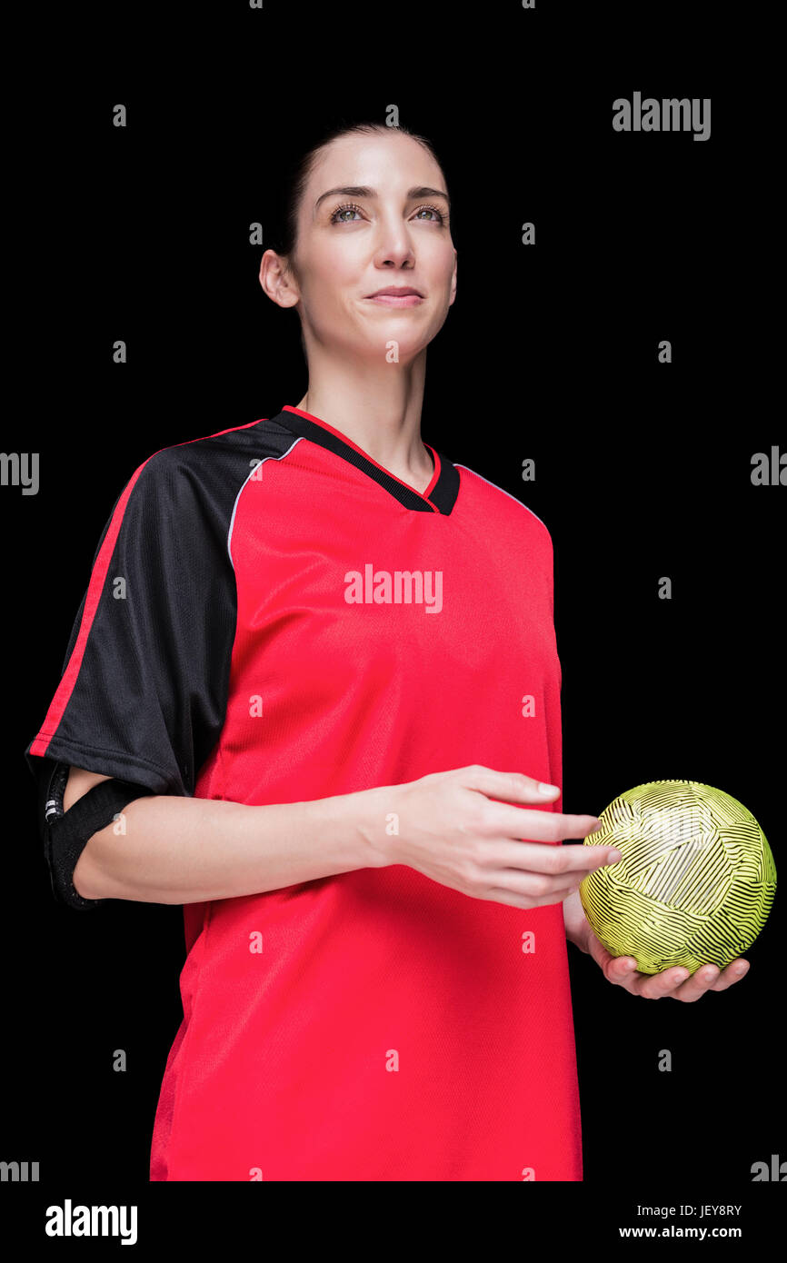 Atleta femminile tenendo una palla a mano Foto Stock