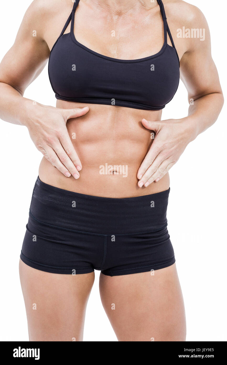 Atleta femminile toccando il suo calcolatore ABS Foto Stock