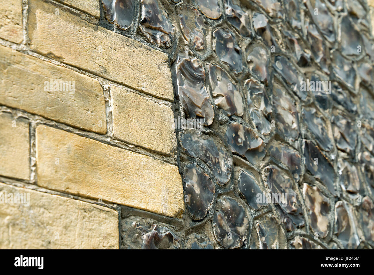 Muro di mattoni e pietra focaia Foto Stock