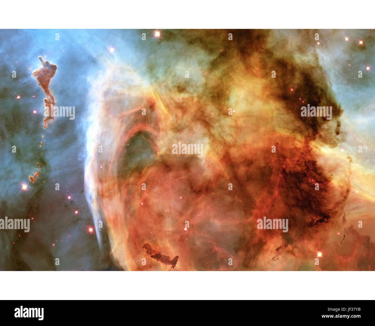 In precedenza i dettagli invisibili di una misteriosa struttura complessa entro il Carina Nebula (NGC 7332) sono rivelate da questa immagine della nebulosa Keyhole,' ottenuti con la NASA il telescopio spaziale Hubble. La foto è un montaggio assemblato da quattro differenti Aprile 1999 pointings telescopio Hubble con ampio campo fotocamera planetario 2, che ha utilizzato sei diversi filtri di colore. Il quadro è dominato da un grande e di forma approssimativamente circolare funzione, che è parte del Keyhole Nebula, denominato nel XIX secolo da Sir John Herschel. Questa regione, circa 8000 anni luce dalla Terra, si trova adiacente al famoso Foto Stock