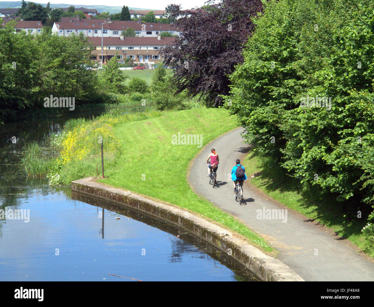 Canale di Forth e Clyde Glasgow Scozia i ciclisti in bici sul percorso di traino ciclismo Scozia Scotland Foto Stock