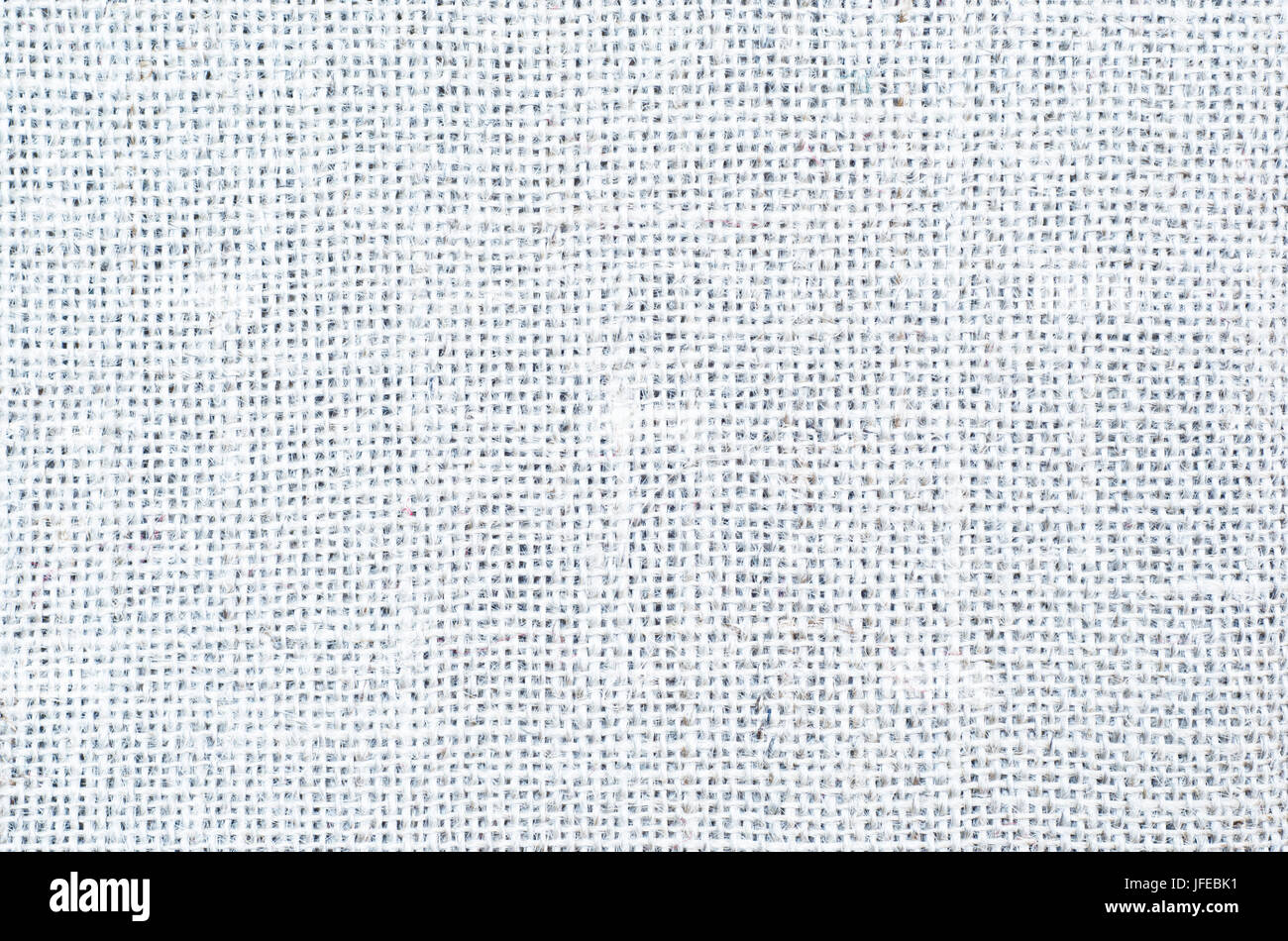 Un tessuto hessian texture di sfondo bianco. Foto Stock