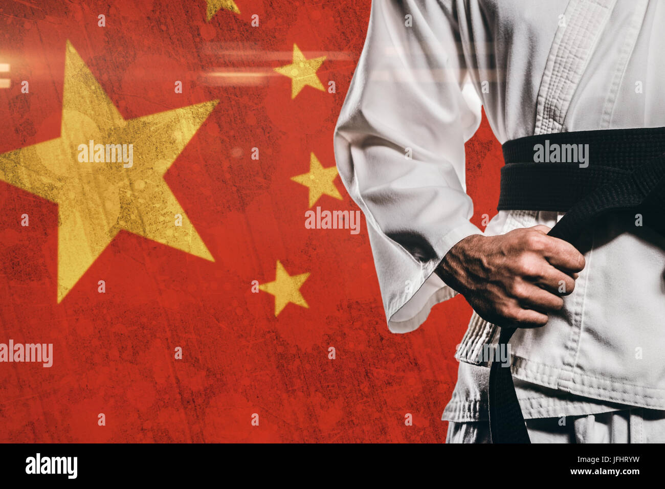 Immagine composita del fighter di serraggio della cinghia di karate Foto Stock