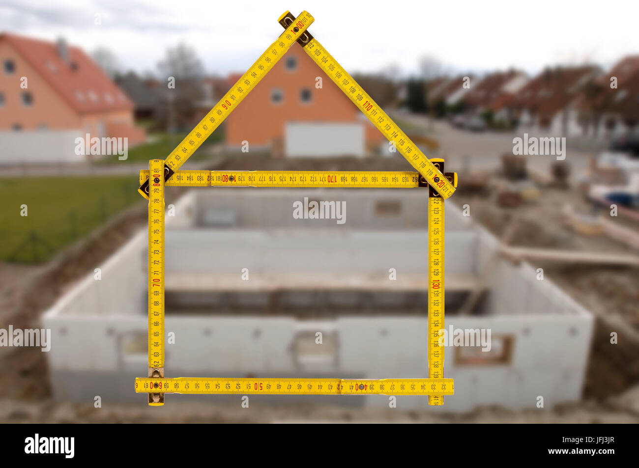 Costruzione di una casa e le vendite con il bastone cantiere come icona Foto Stock
