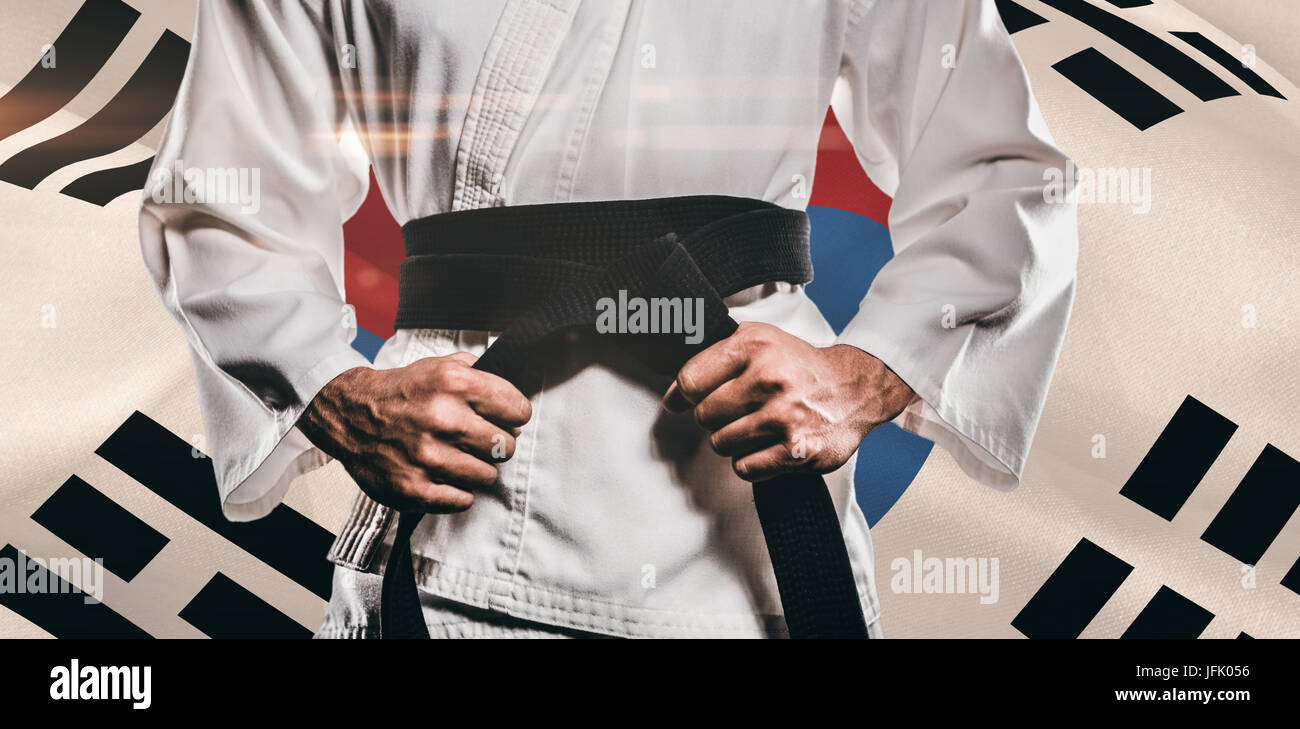 Immagine composita del fighter di serraggio della cinghia di karate Foto Stock