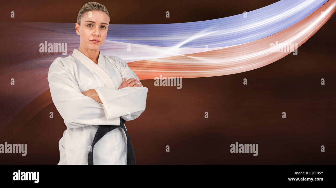 Immagine composita di atleta femminile in posa di kimono Foto Stock