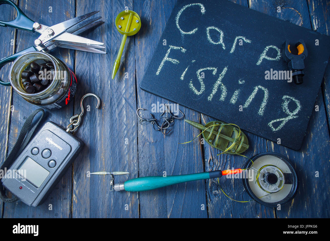 La piastra con la scritta - carp fishing. Composizione della pesca. Foto Stock
