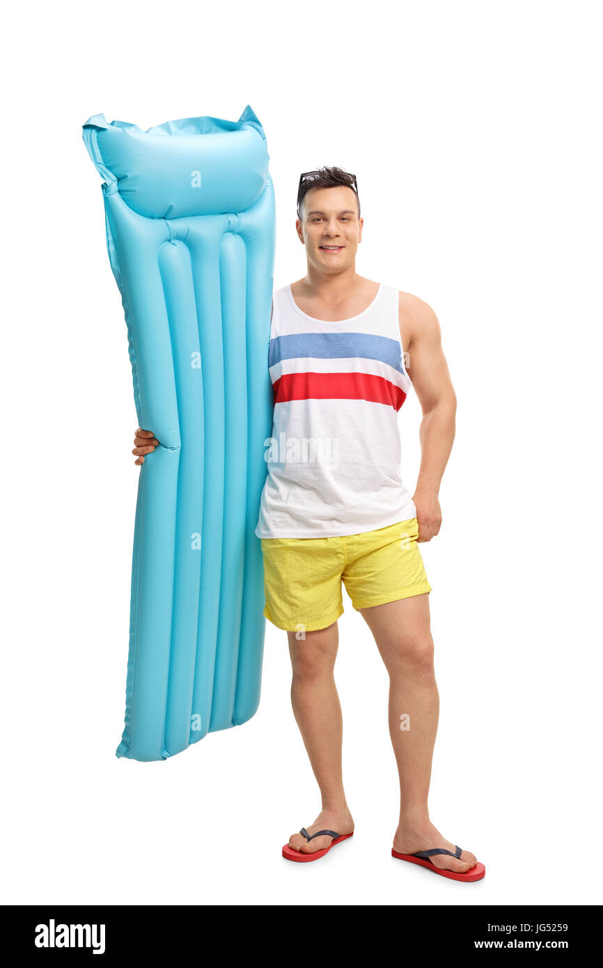 A piena lunghezza Ritratto di un turista di trattenimento di un materasso ad aria isolata su sfondo bianco Foto Stock