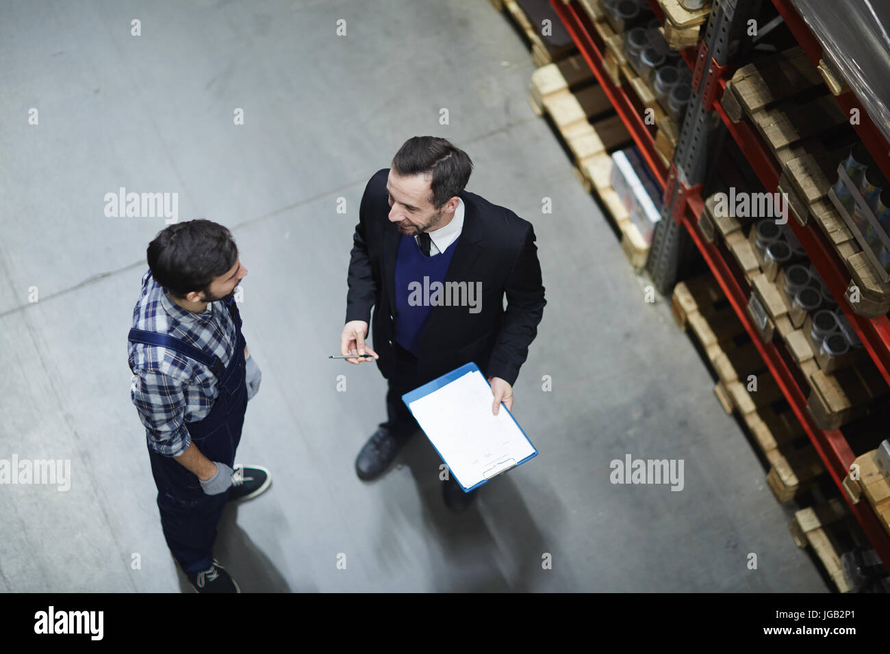Direttore e lavoratore Foto Stock
