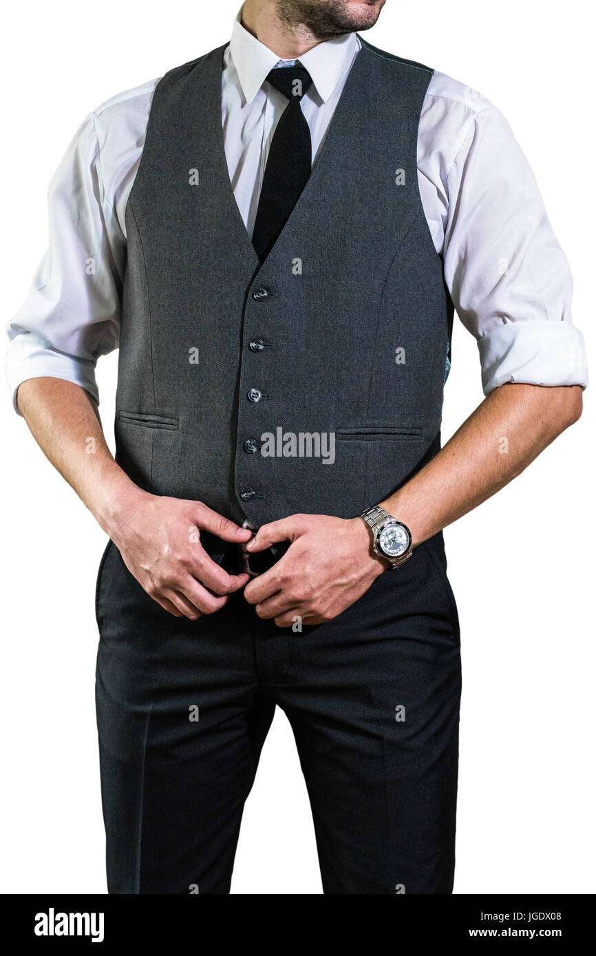 Un giovane imprenditore in una camicia bianca con un tirante si tiene le mani sulla sua cintura. Un ragazzo, una hipster in grigio di un gilet e una camicia con un arrotolato sl Foto Stock