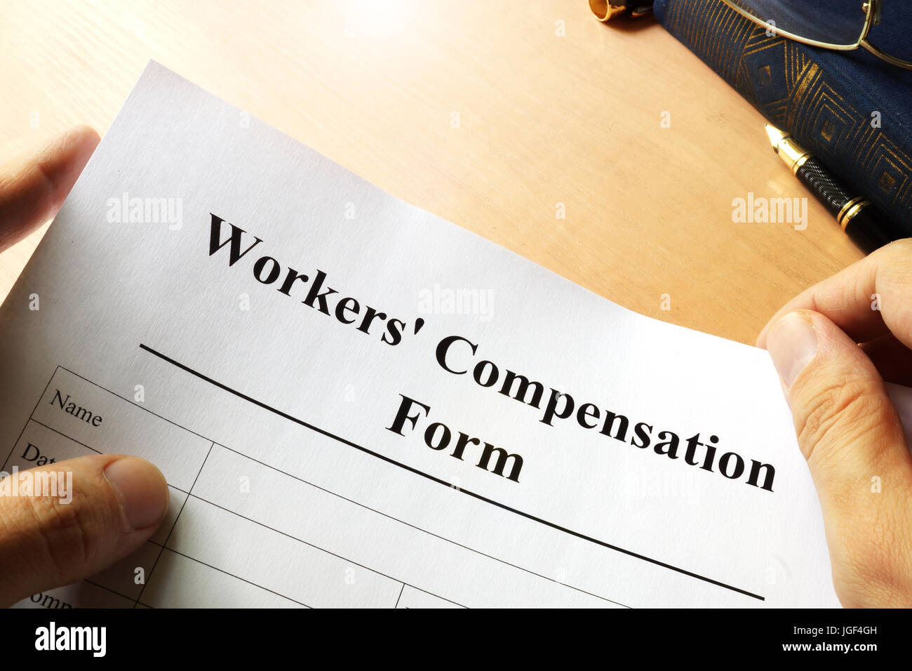 Compensazione Lavoratori modulo su una tabella. Foto Stock