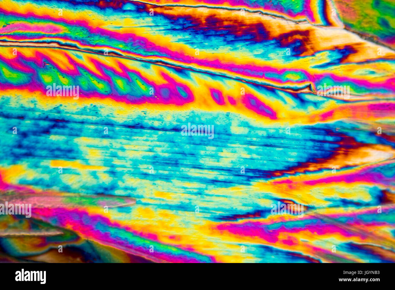 Riprese al microscopio di carbonato di sodio con microcristalli in luce polarizzata Foto Stock