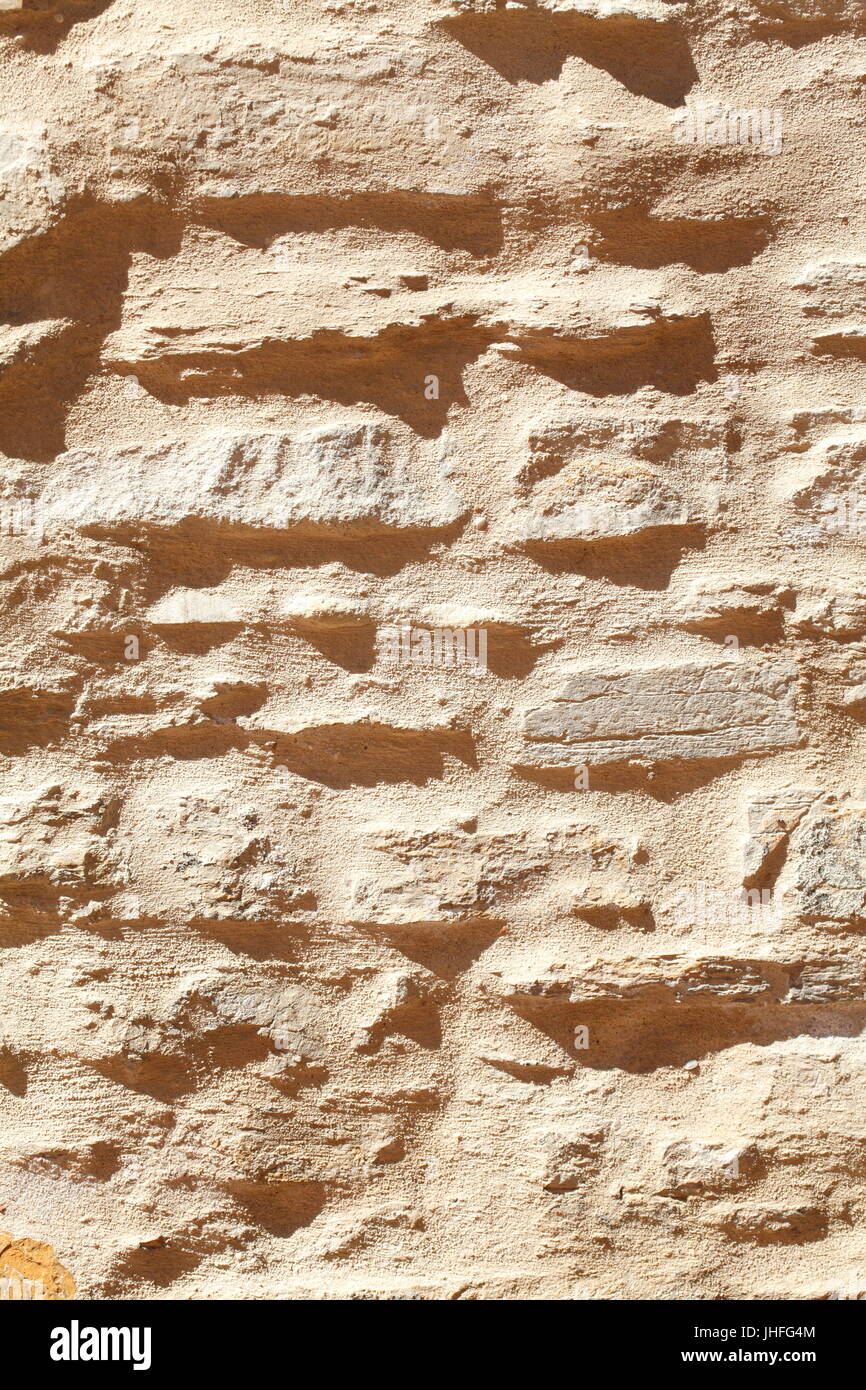 Vecchio brown pietra da un antico muro di pietra Foto Stock