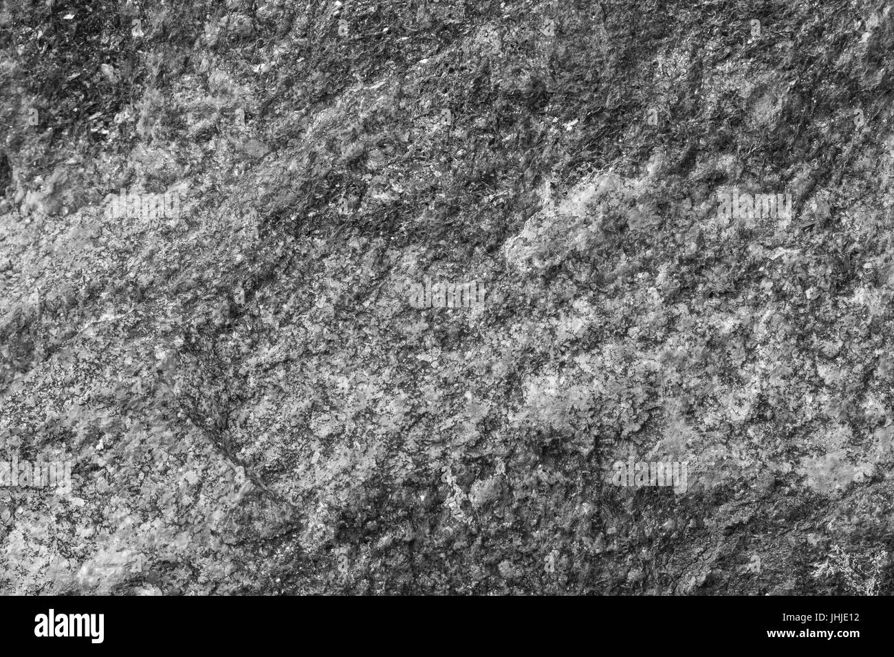 Close-up di una roccia texture di superficie in bianco e nero. Foto Stock