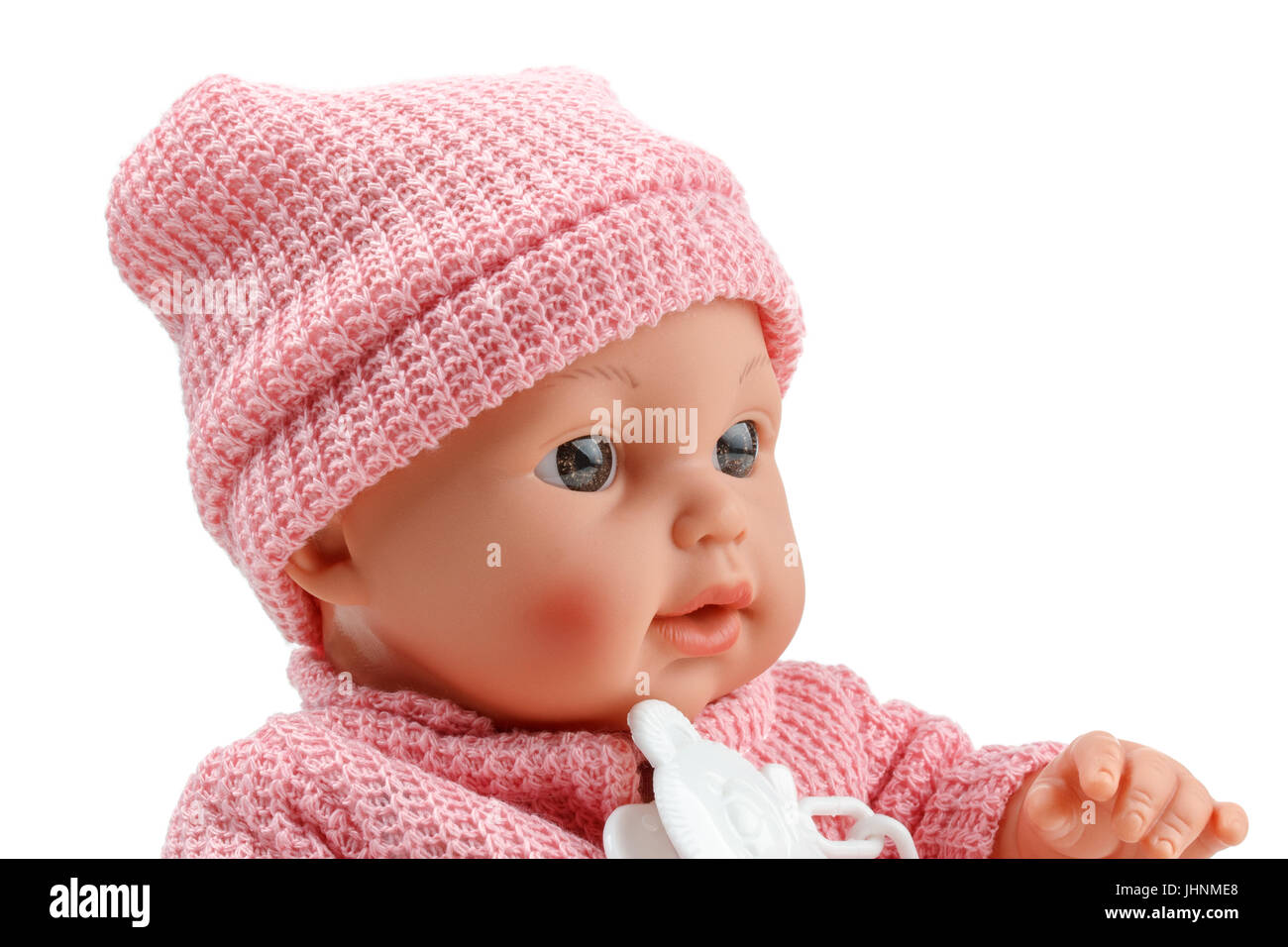 Bambola giocattolo bambino, in rosa camicetta con succhietto su sfondo isolato Foto Stock