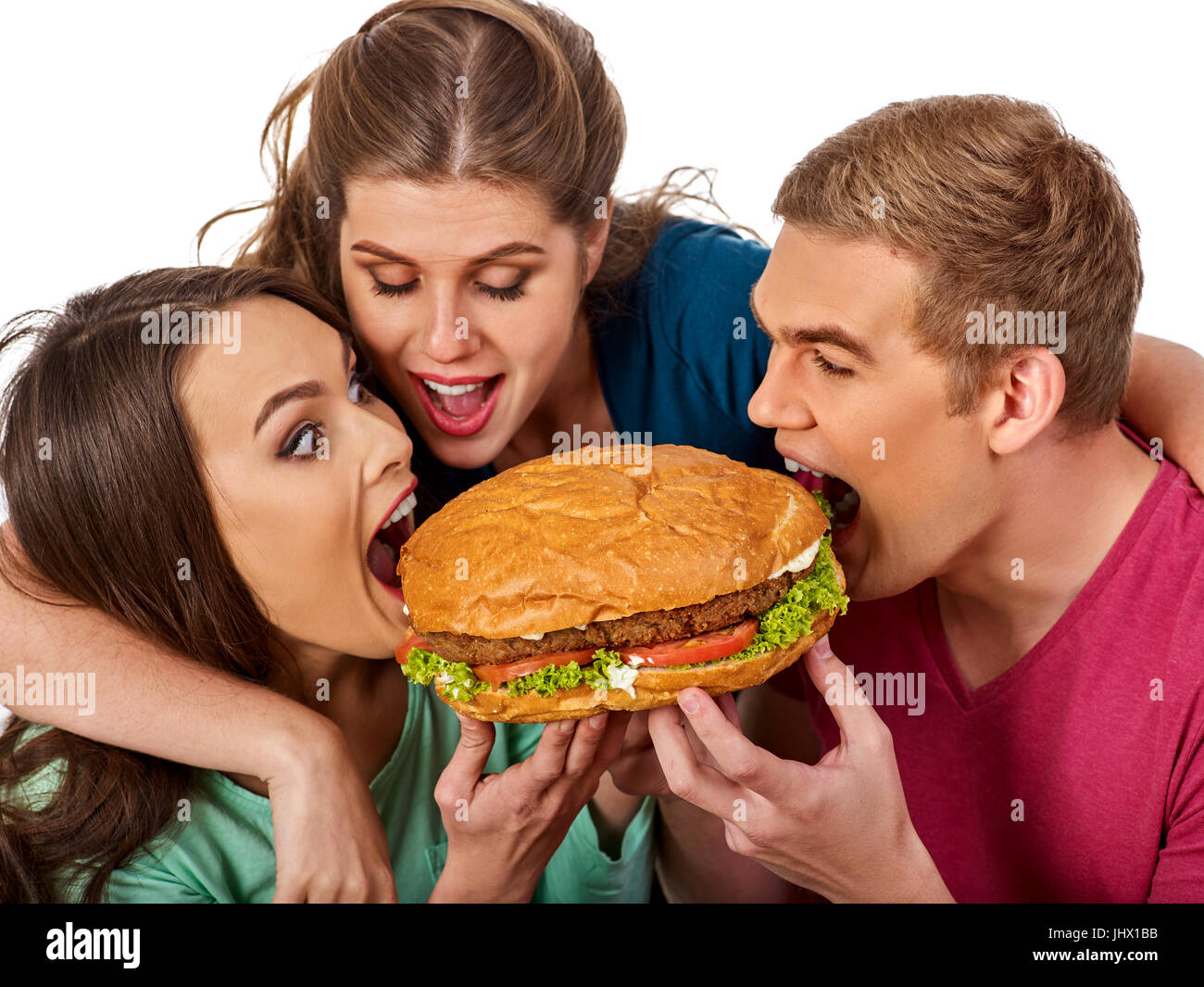 Hamburger fast food nelle persone amici mani . Foto Stock