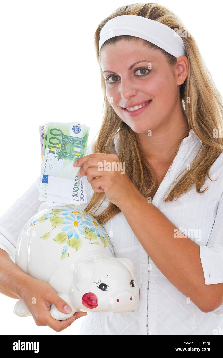 Giovane donna alimenta il salvadanaio - Giovane donna alimenta il salvadanaio, Junge Frau füttert Sparschwein - Giovane donna alimenta il salvadanaio Foto Stock