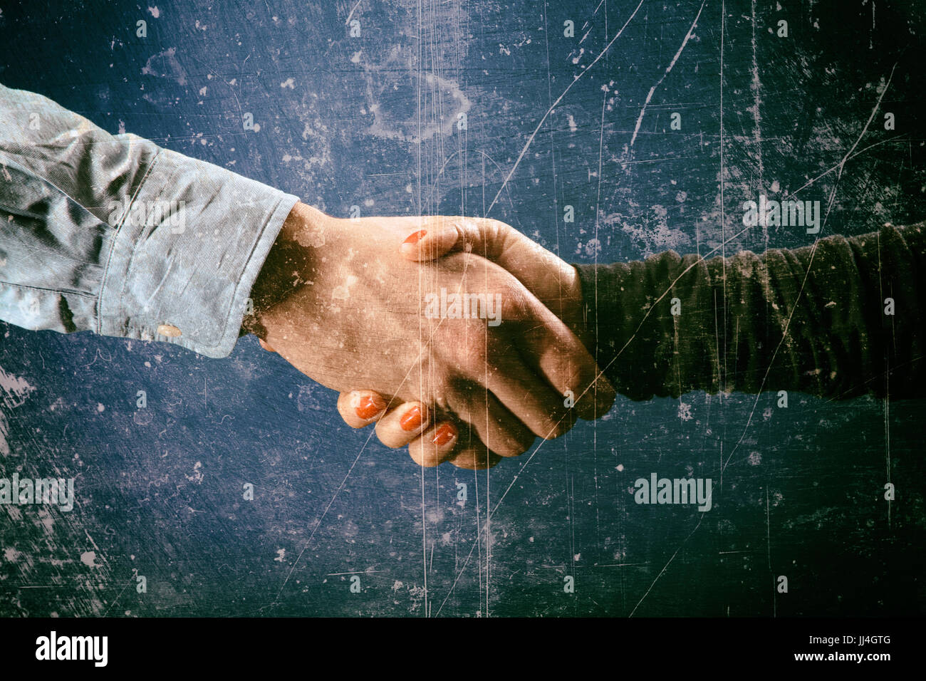 Stile grunge handshake di imprenditore e imprenditrice Foto Stock