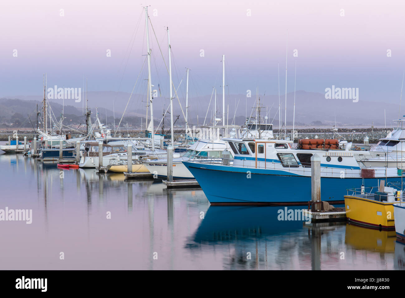 Pilastro punto porto al tramonto. Foto Stock