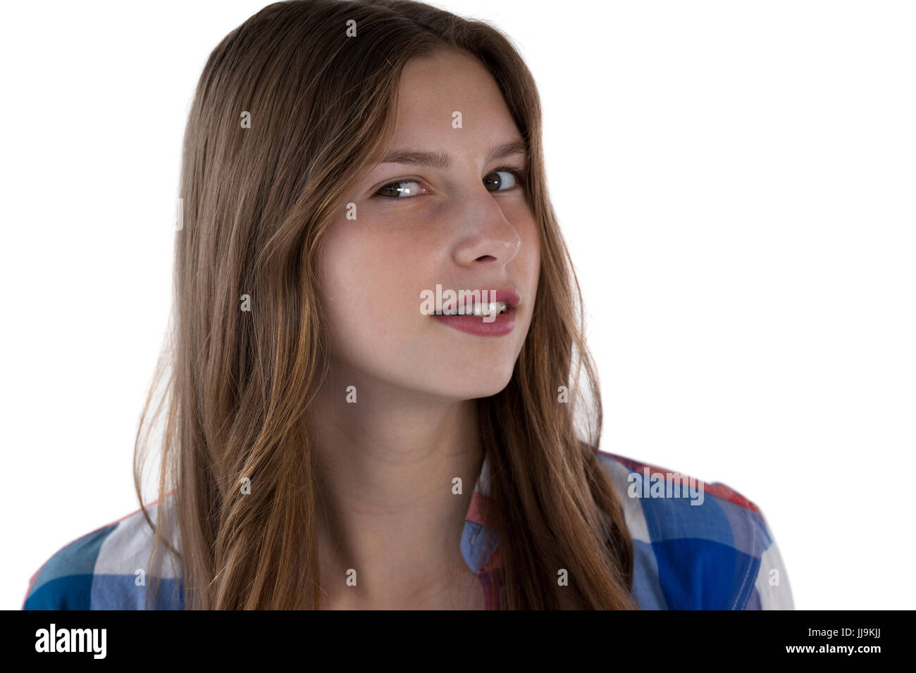 Ritratto di adolescente ragazza sorridente contro uno sfondo bianco Foto Stock