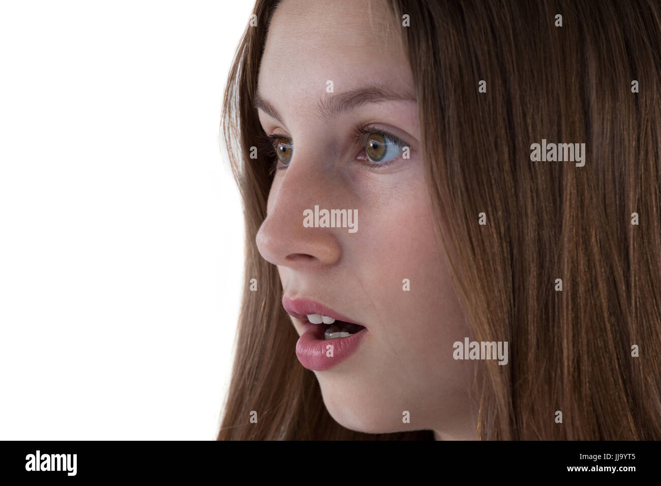 Close-up di sorpreso ragazza adolescente contro uno sfondo bianco Foto Stock