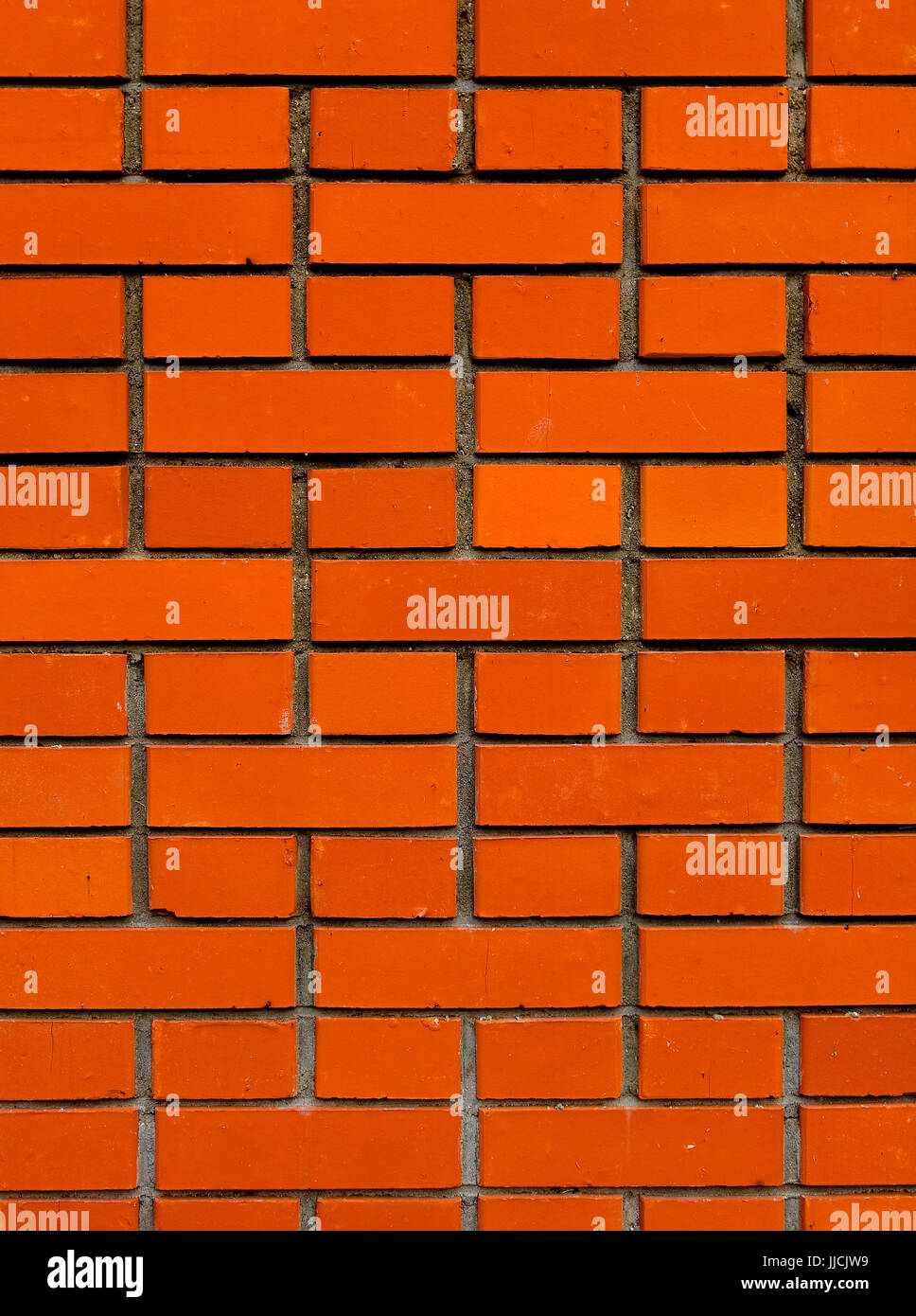 Sfondo. muratura di mattoni rossi con fessurazioni. Foto Stock