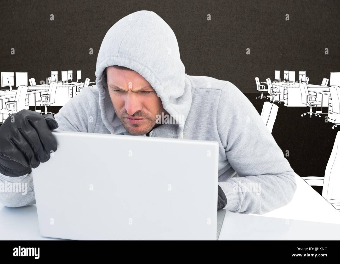 Hacker che lavora sul computer portatile di fronte all ufficio di sfondo di disegno Foto Stock