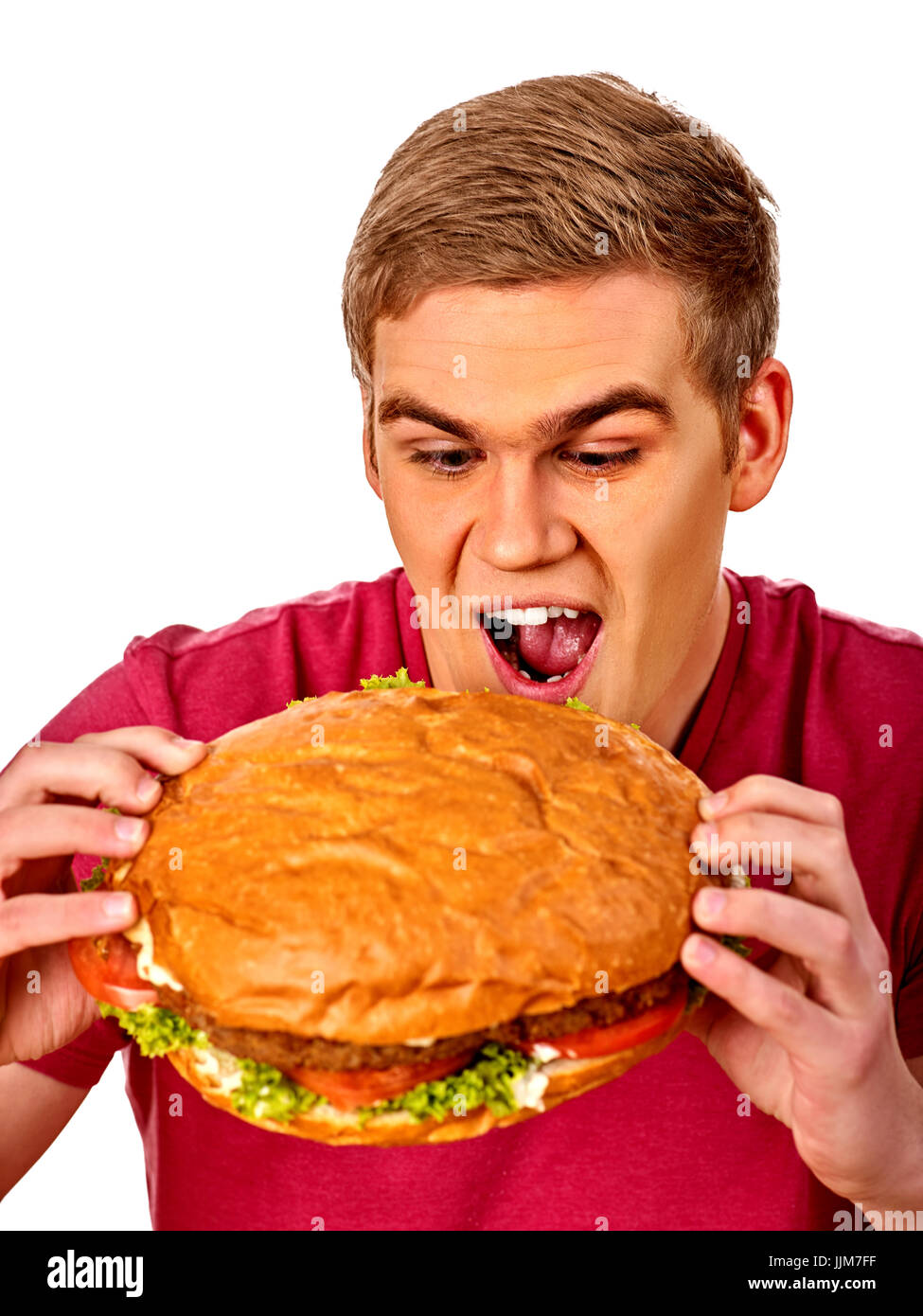 L'uomo mangiare hamburger. Ragazza morso del grande burger Foto Stock