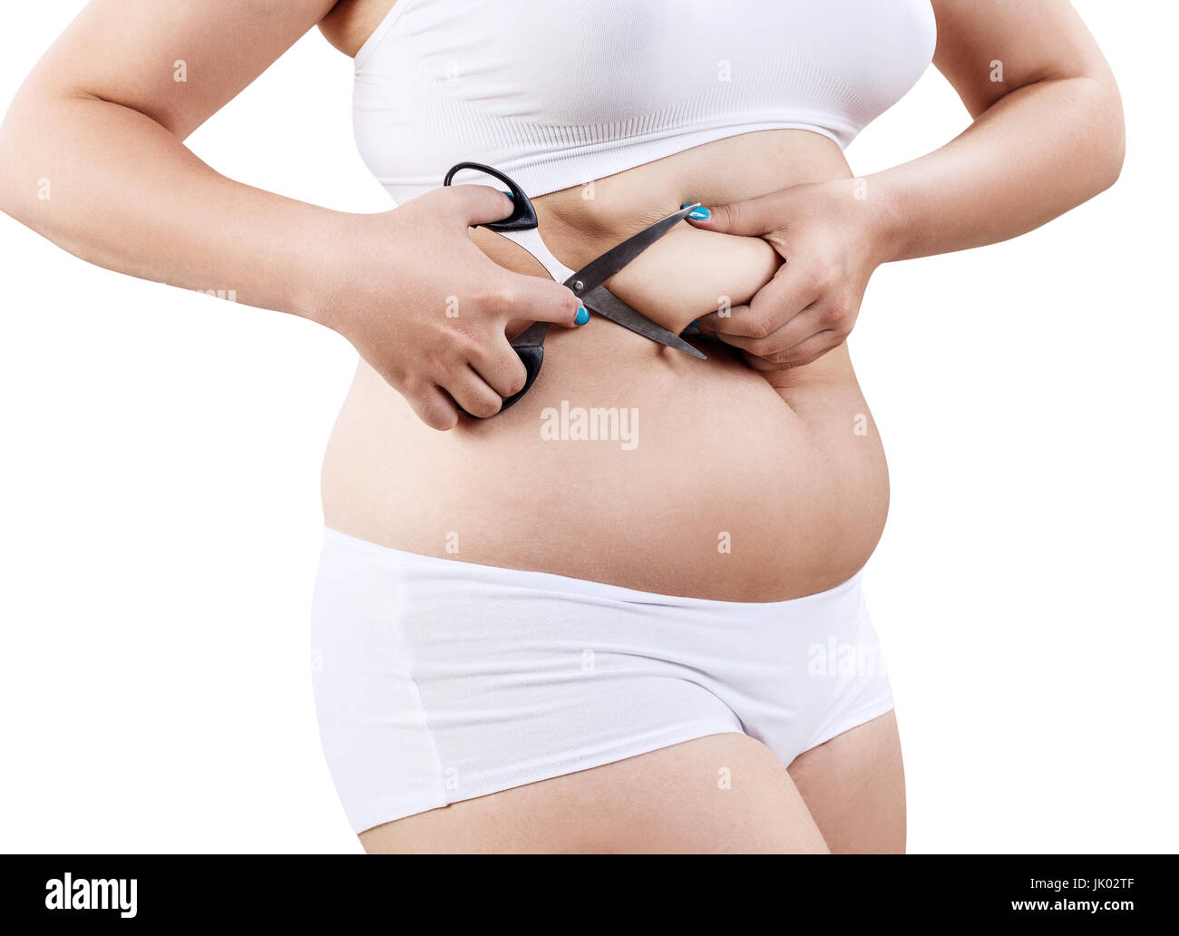 Donna con obesità tenendo le forbici per il ventre e il taglio di grasso. Foto Stock