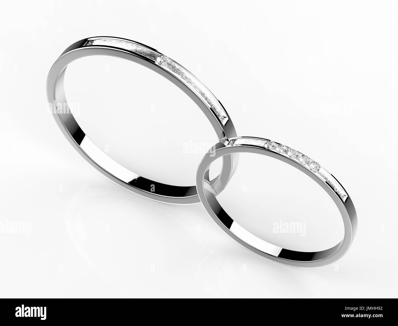 Platino anelli di nozze su sfondo bianco Foto Stock
