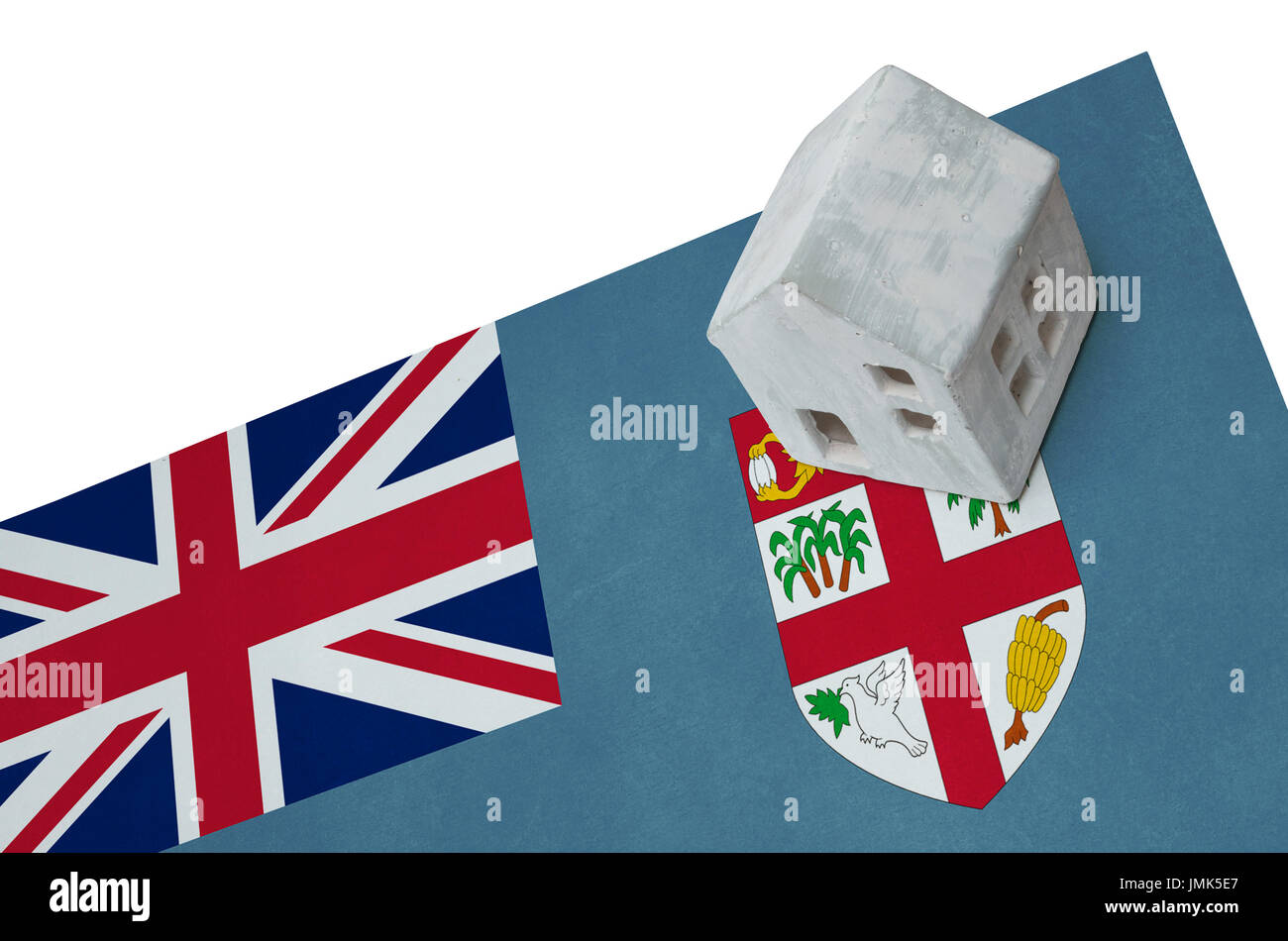 Piccola casa su una bandiera - vivere o la migrazione verso le isole Figi Foto Stock