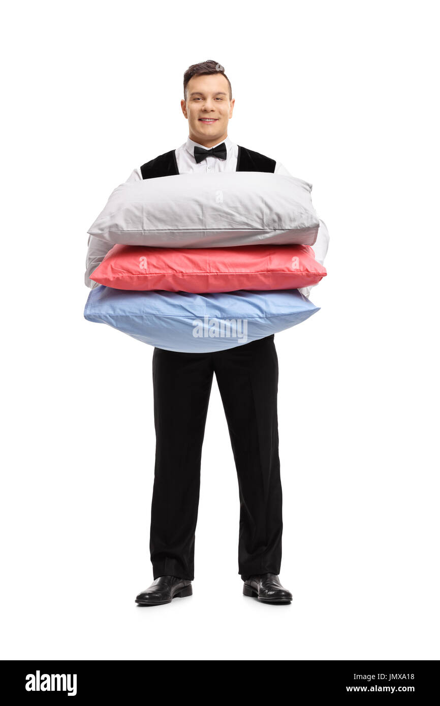 A piena lunghezza Ritratto di un maggiordomo con cuscini isolati su sfondo bianco Foto Stock