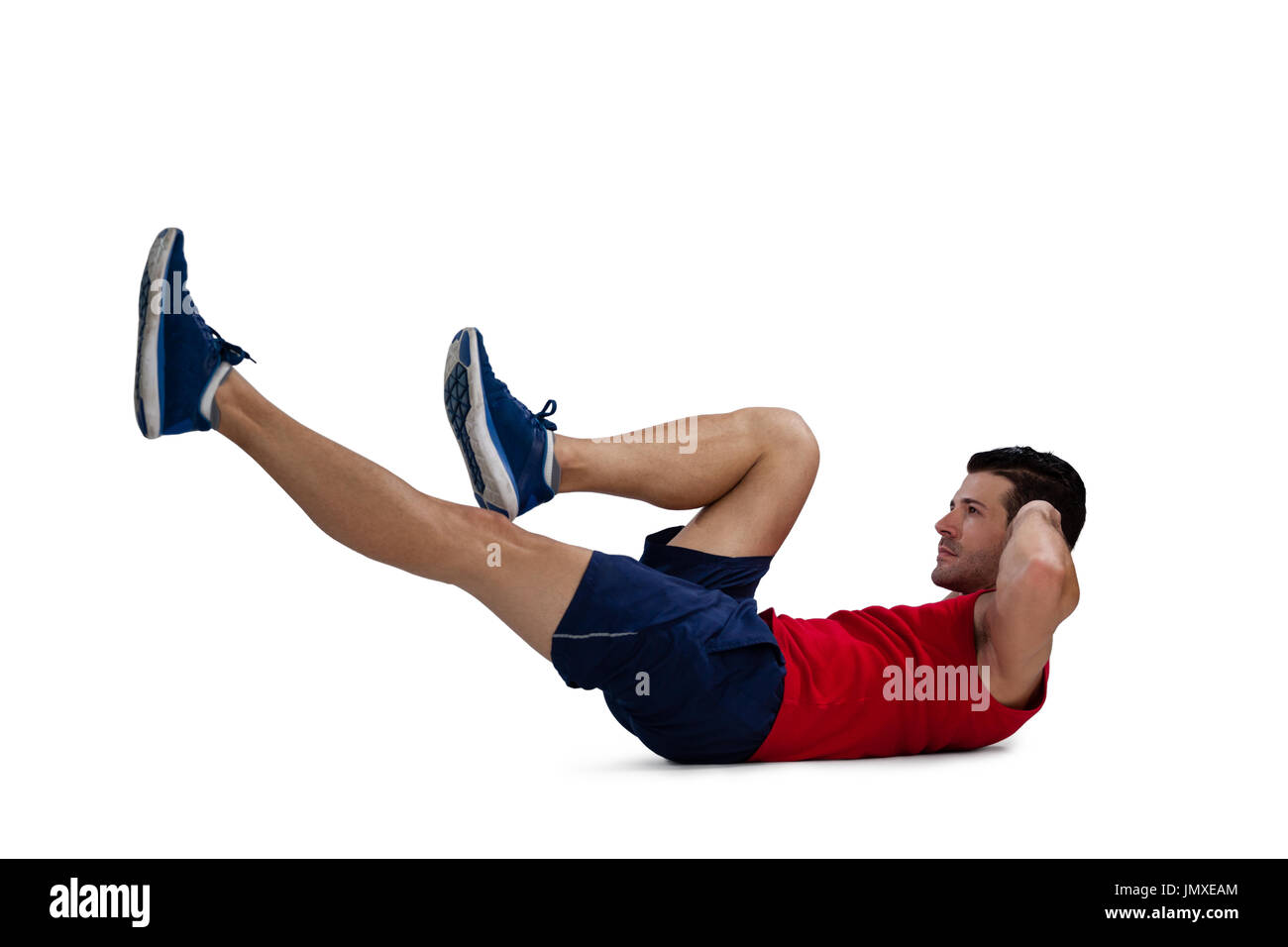Vista laterale del lettore sport esercizio mentre giace contro uno sfondo bianco Foto Stock