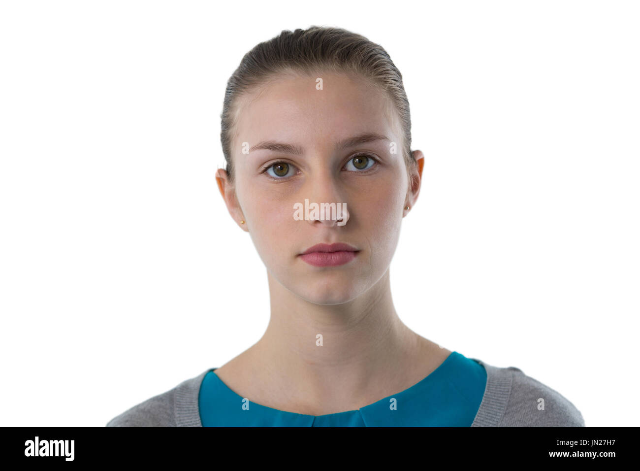 Ritratto di fiducioso ragazza adolescente in piedi contro uno sfondo bianco Foto Stock
