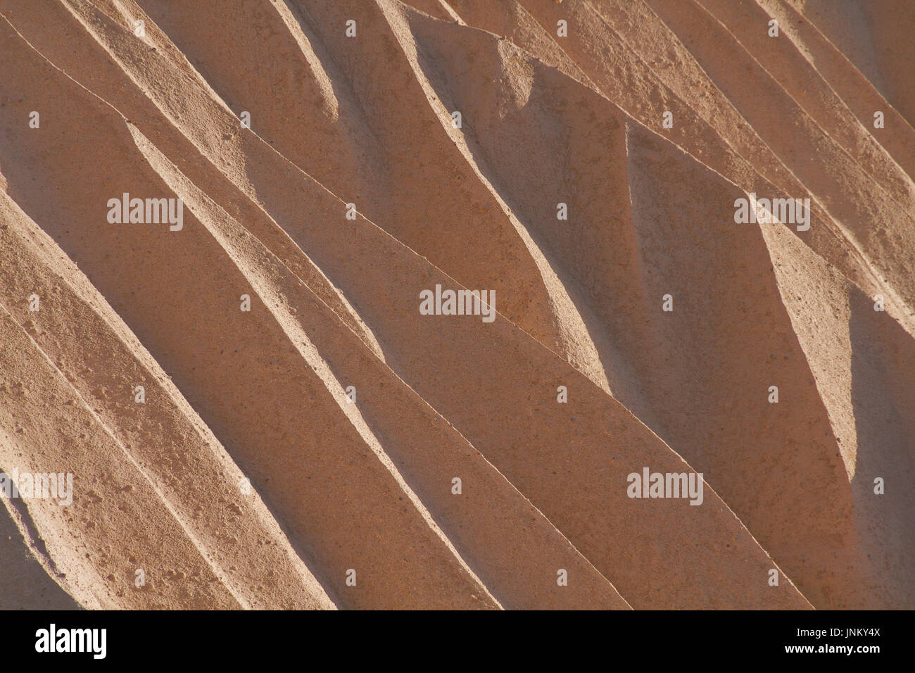 Ceneri vulcaniche formazioni guardando come dune di sabbia in Cappadocia, Turchia. Foto Stock