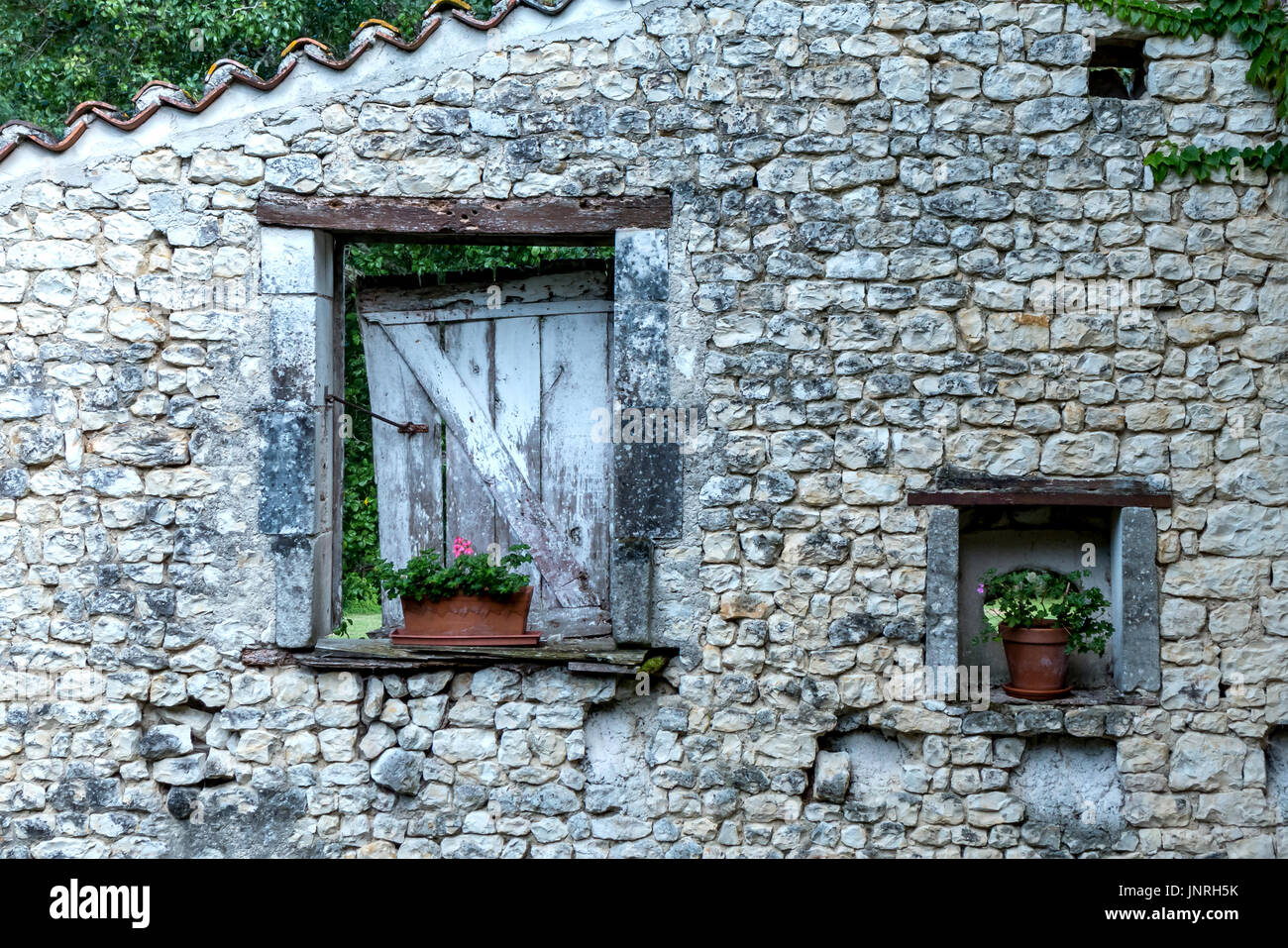 Rurale fascino francese sul lato di un edificio Foto Stock