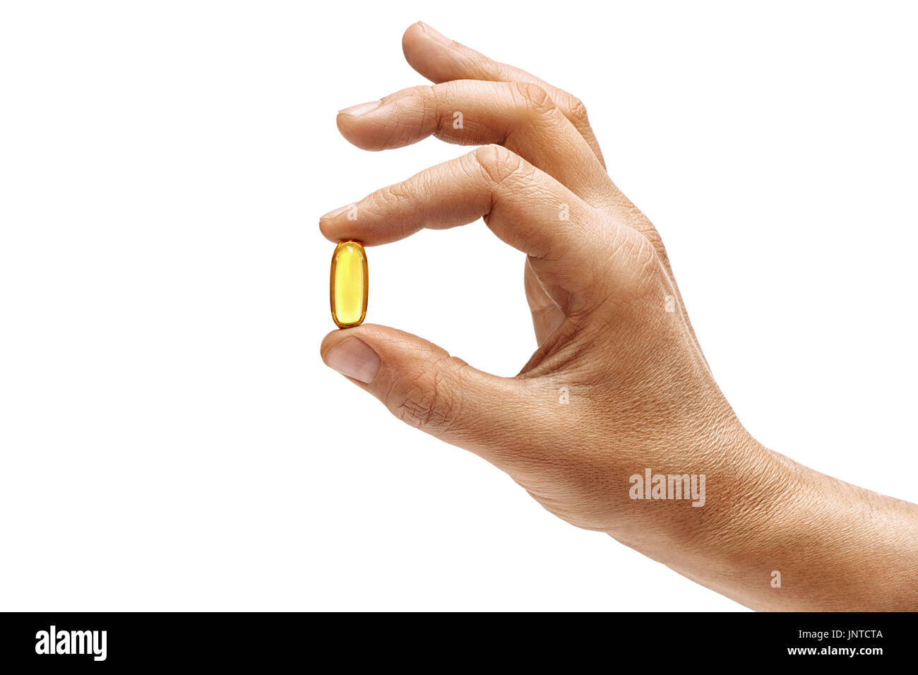 Mano d'uomo azienda Omega 3 capsule isolati su sfondo bianco. Close up. Alta risoluzione Foto Stock