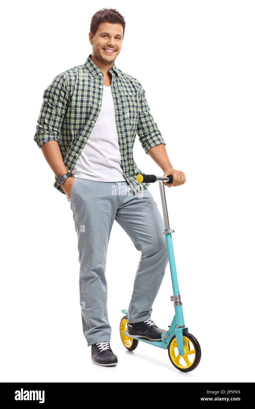 A piena lunghezza Ritratto di un giovane ragazzo con uno scooter isolati su sfondo bianco Foto Stock