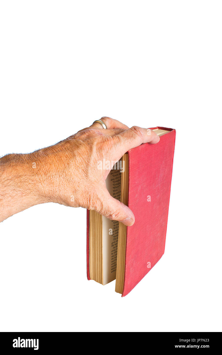 A sinistra la mano maschio segnando il suo posto con il suo dito in un libro. Foto Stock