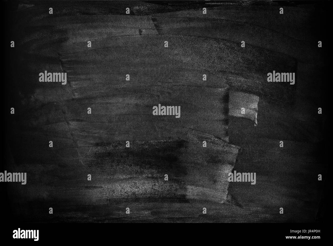 Lavagna con macchie macchie da un testo scritto in Chalk Foto Stock