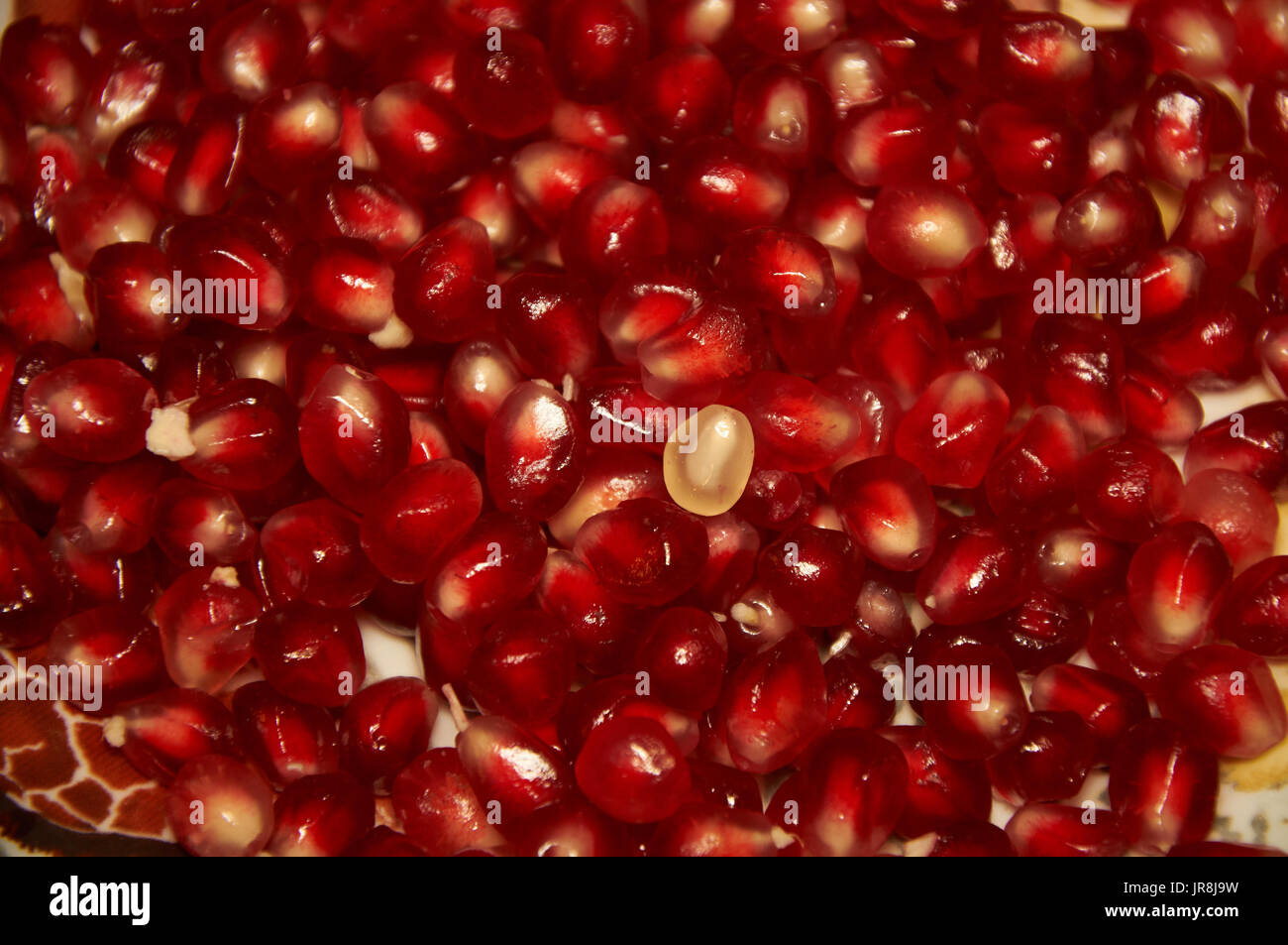 Red succosa i semi di melograno sfondo Foto Stock