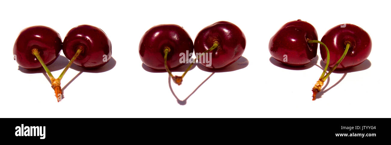La ciliegia. Le ciliegie in bianco ciotola. Cherry su sfondo bianco. Foto Stock